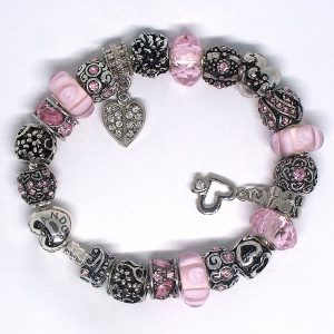 Flower charm bracelet with pink, black, silver, love, heart, pink stone clip, Murano glass, faceted beads, and European charms on an authentic Pandora bracelet