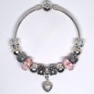 Murano glass bangle bracelet with pink, silver, floral, heart clips, lampwork Murano glass beads, and European-style charms on an authentic Pandora bangle