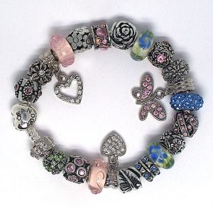 Butterfly charm bracelet with pink, blue, green, silver, crystal, butterfly, rhinestone clip, Murano glass, pavé crystal, and European-style charms on an authentic Pandora bracelet