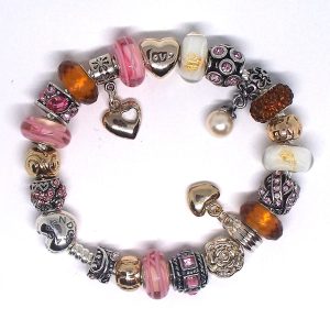 Cherry charm bracelet with cherry red, pink, chocolate brown, white, silver, heart clip, Murano glass, faceted beads, pavé crystal, and European-style charms on an authentic Pandora bracelet