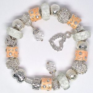 Charm bracelet silver style with peach, white, silver, crystal, heart clip, Murano glass, pavé crystal, and European-style charms on an authentic Pandora bracelet