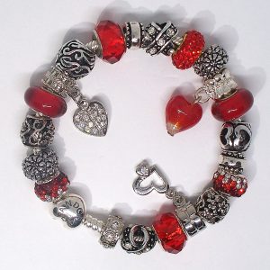 Authentic Pandora red charm bracelet with heart charms and silver bead details Red and silver Valentine charm bracelet with European-style charms