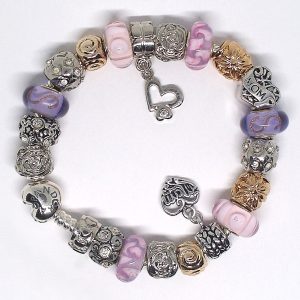 Mother's Day charm bracelet with pink, lavender, gold, silver, heart clip, Murano glass, mom gift details, and European charms on an authentic Pandora bracelet