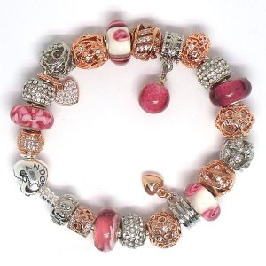 Rose gold charm bracelet with pink, gold, rose gold-plated, silver, heart clip, Murano glass beads, sparkle, floral details, and European charms on an authentic Pandora bracelet
