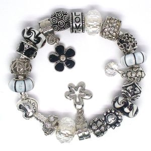 Mod charm bracelet with black, white, silver, rhinestone clip, Murano glass, faceted beads, sparkle, and European-style charms on an authentic Pandora bracelet