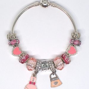 Coquette girl charm bracelet Love to Shop with pink, silver, heart, love, pavé crystal, faceted glass, and European-style charms on an authentic Pandora bangle