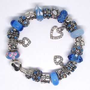 Blue flower charm bracelet with pastel blue, periwinkle, pink, silver, floral, heart, and European-style charms on an authentic Pandora bracelet