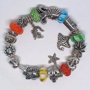 Florida-inspired Beach charm bracelet with ocean-inspired blue, orange, green, yellow, and silver charms