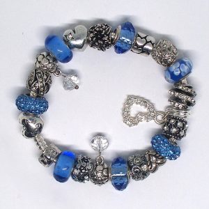 Blue floral charm bracelet with periwinkle, silver, heart, and floral European-style charms